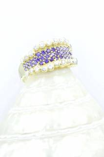 Ring with white and purple zircons