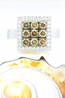 Ring with brown and white diamonds on a square