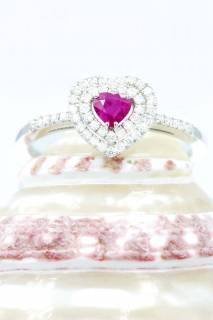 Ring with ruby and diamonds in a heart composition