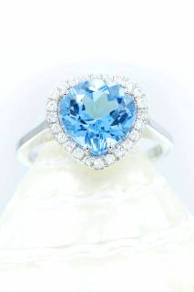 Ring with blue topaz and diamonds