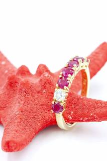 Ring with diamond and rubies in a row