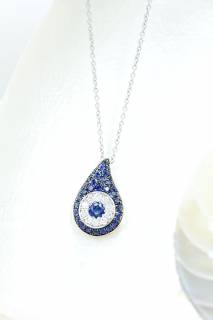 Pendant with sapphires and diamonds in a tear compostion